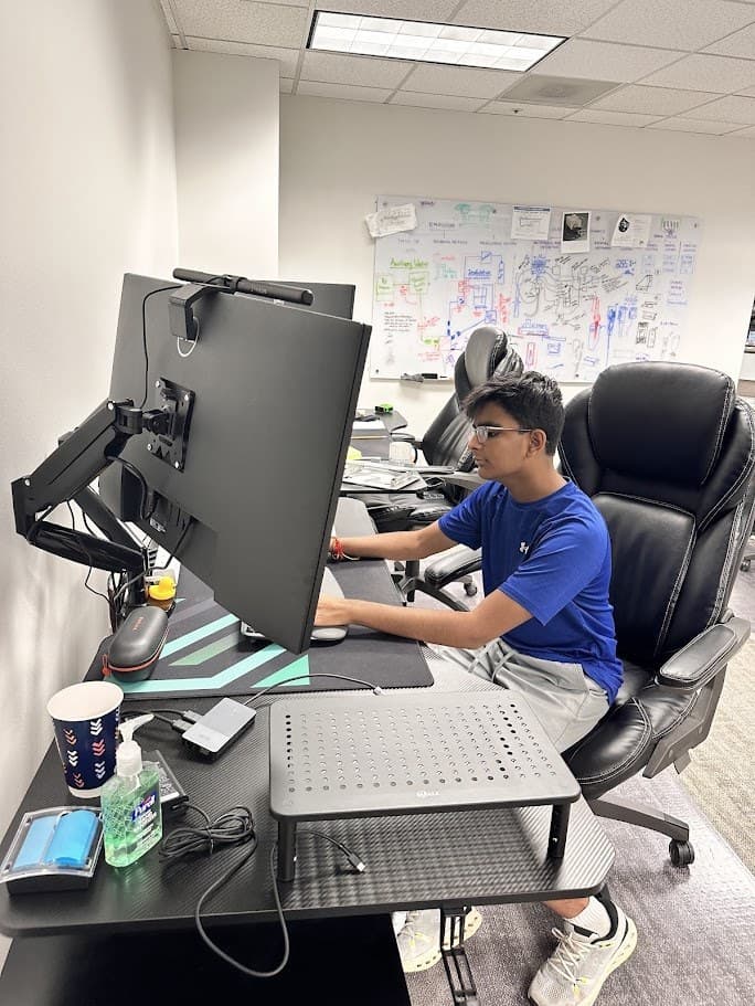 Avyakt working at a laptop